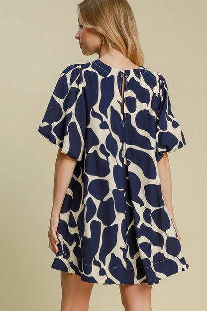 Zoraida® | Tweekleurige jurk met abstracte print en pofmouwen