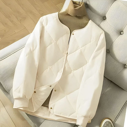 Yara® | Zwart pufferjack met moderne gewatteerde print voor dames