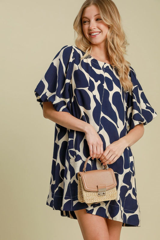 Zoraida® | Tweekleurige jurk met abstracte print en pofmouwen